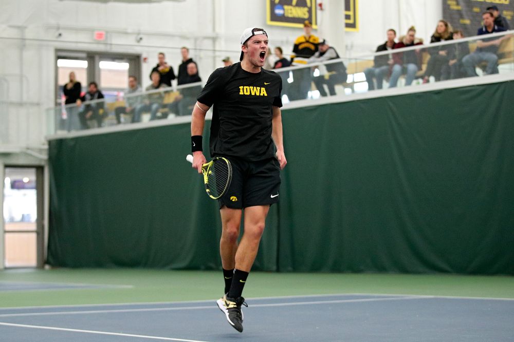 Iowa’s Joe Tyler celebrates after winning his match against Marquette at the Hawkeye Tennis and Recreation Complex in Iowa City on Saturday, January 25, 2020. (Stephen Mally/hawkeyesports.com)