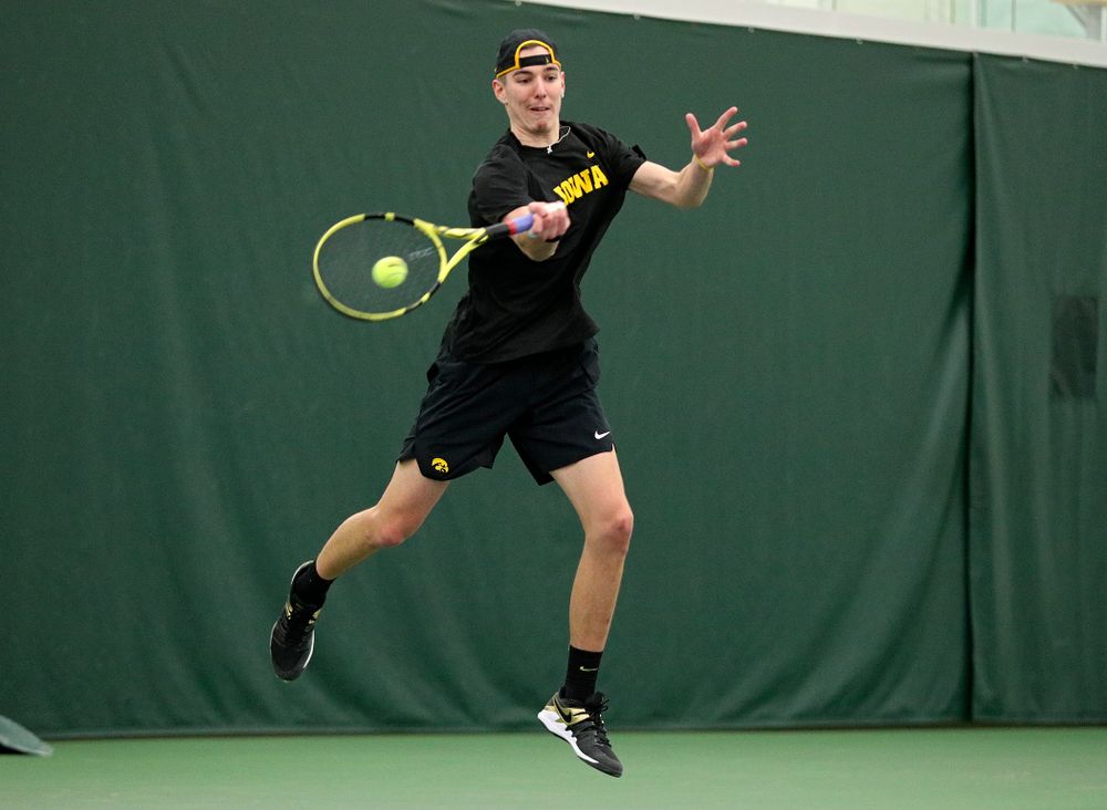 Iowa’s Nikita Snezhko returns a shot during his singles match at the Hawkeye Tennis and Recreation Complex in Iowa City on Friday, February 14, 2020. (Stephen Mally/hawkeyesports.com)