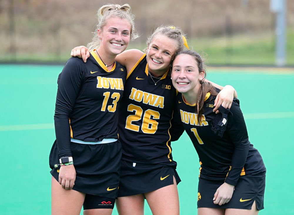 Iowa’s Leah Zellner (13), Maddy Murphy (26), and Amy Gaiero (1) after winning their game at Grant Field in Iowa City on Saturday, Oct 26, 2019. (Stephen Mally/hawkeyesports.com)