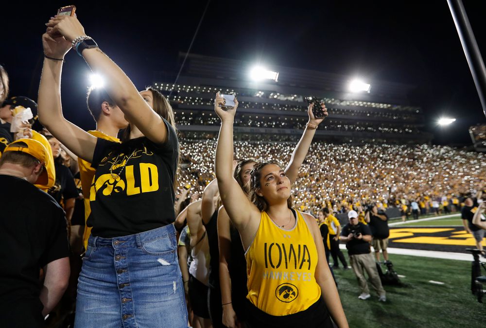 Fans wave to patients in the Stead Family Children's Hospital at halftime during a game against Northern Iowa at Kinnick Stadium on September 15, 2018. (Tork Mason/hawkeyesports.com)