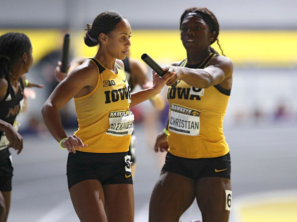 Iowa’s Anaya Alexander (from left) takes the baton from Antonise Christian as they run the women’s 1600 meter relay event during the Hawkeye Invitational at the Recreation Building in Iowa City on Saturday, January 11, 2020. (Stephen Mally/hawkeyesports.com)