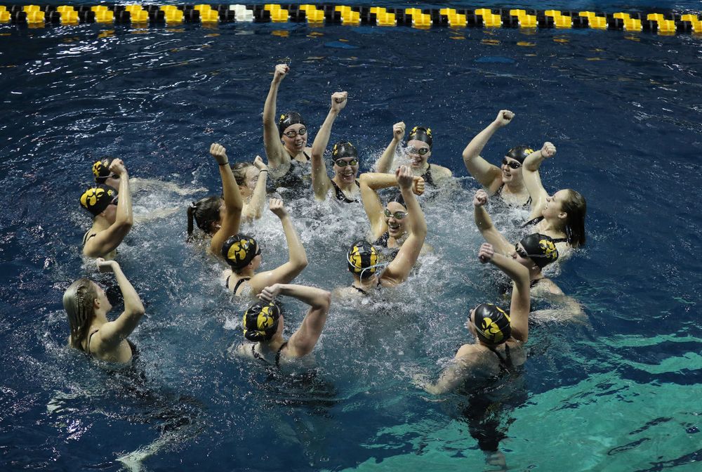 The Iowa Hawkeyes swim the Fight Song following their win over the Iowa State Cyclones in the Iowa Corn Cy-Hawk Series Friday, December 7, 2018 at at the Campus Recreation and Wellness Center. (Brian Ray/hawkeyesports.com)