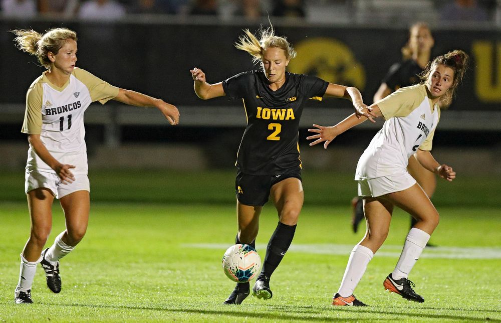 Iowa midfielder Hailey Rydberg (2) moves between two defenders during the second half of their match against Western Michigan at the Iowa Soccer Complex in Iowa City on Thursday, Aug 22, 2019. (Stephen Mally/hawkeyesports.com)
