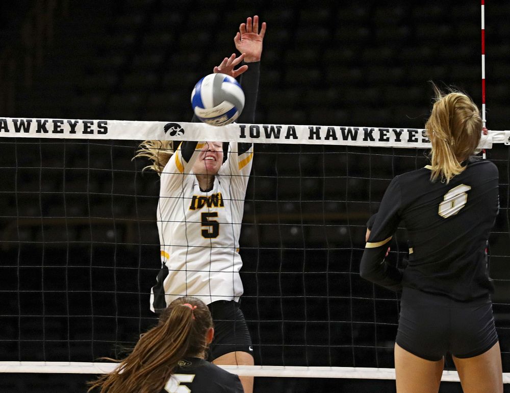 Iowa’s Meghan Buzzerio (5) blocks a shot during the third set of their Big Ten/Pac-12 Challenge match against Colorado at Carver-Hawkeye Arena in Iowa City on Friday, Sep 6, 2019. (Stephen Mally/hawkeyesports.com)