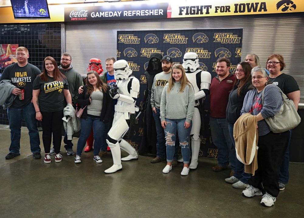 Iowa Hawkeyes fan pose with Star Wars characters on the concourse before the game at Carver-Hawkeye Arena in Iowa City on Sunday, December 29, 2019. (Stephen Mally/hawkeyesports.com)