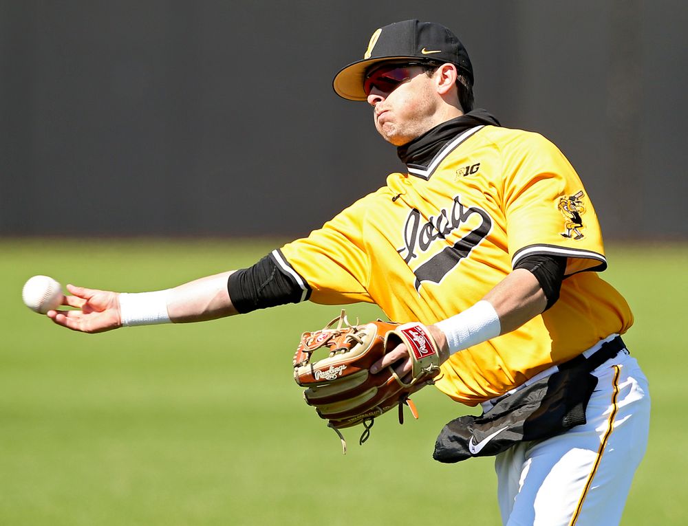 Iowa Hawkeyes second baseman Mitchell Boe (4) throws to first for an out during the fifth inning against Illinois at Duane Banks Field in Iowa City on Sunday, Mar. 31, 2019. (Stephen Mally/hawkeyesports.com)