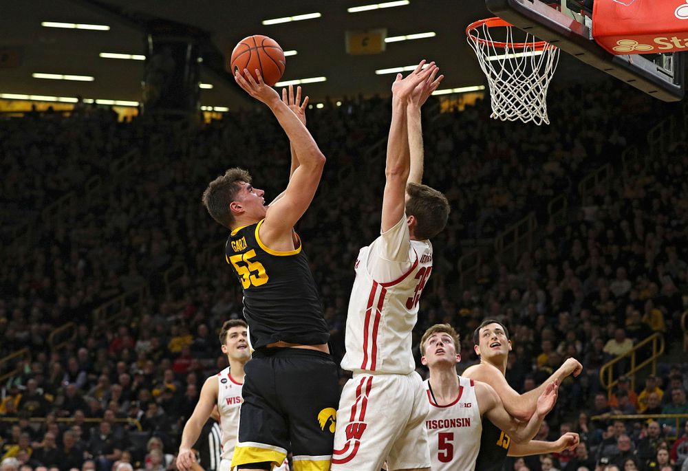 Iowa Hawkeyes center Luka Garza (55) puts up a shot during the second half of their game at Carver-Hawkeye Arena in Iowa City on Monday, January 27, 2020. (Stephen Mally/hawkeyesports.com)