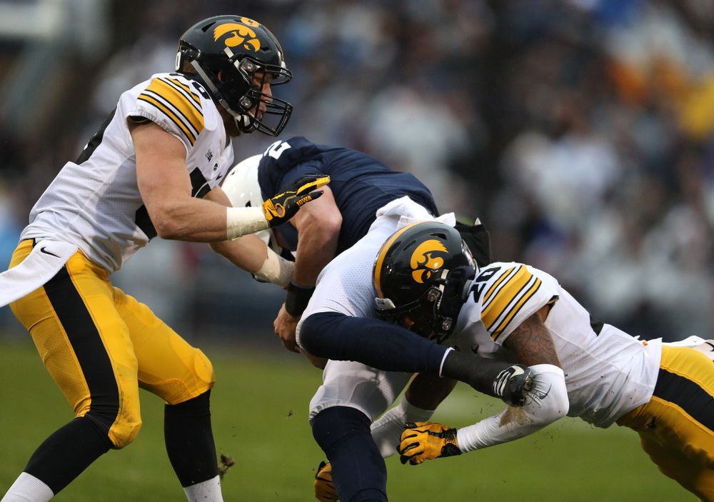 Iowa Hawkeyes defensive back Jake Gervase (30) and defensive back Julius Brents (20) against the Penn State Nittany Lions Saturday, October 27, 2018 at Beaver Stadium in University Park, Pa. (Brian Ray/hawkeyesports.com)