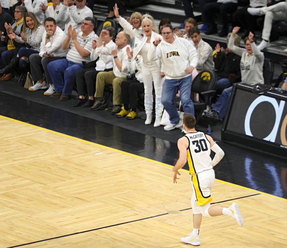 Iowa Hawkeyes guard Connor McCaffery (30) runs down the court after making a 3-pointer during the first quarter of the game at Carver-Hawkeye Arena in Iowa City on Sunday, February 2, 2020. (Stephen Mally/hawkeyesports.com)