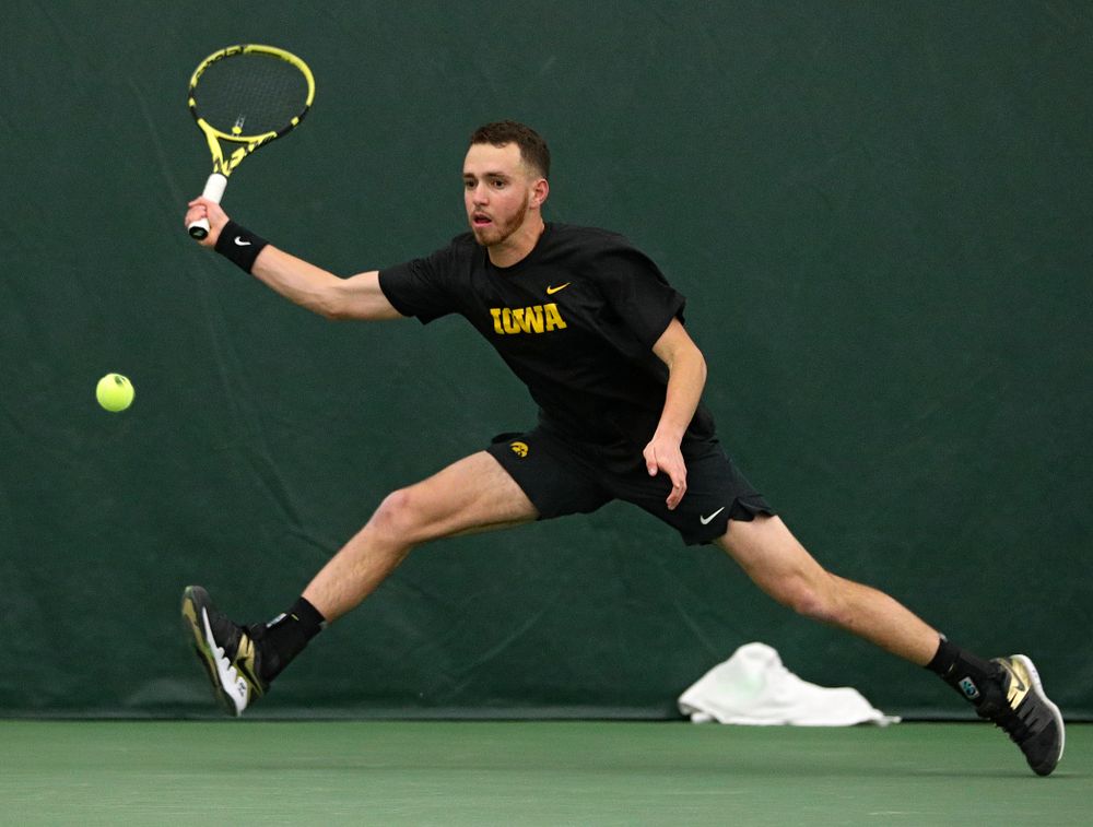 Iowa’s Kareem Allaf returns a shot during his singles match at the Hawkeye Tennis and Recreation Complex in Iowa City on Friday, March 6, 2020. (Stephen Mally/hawkeyesports.com)