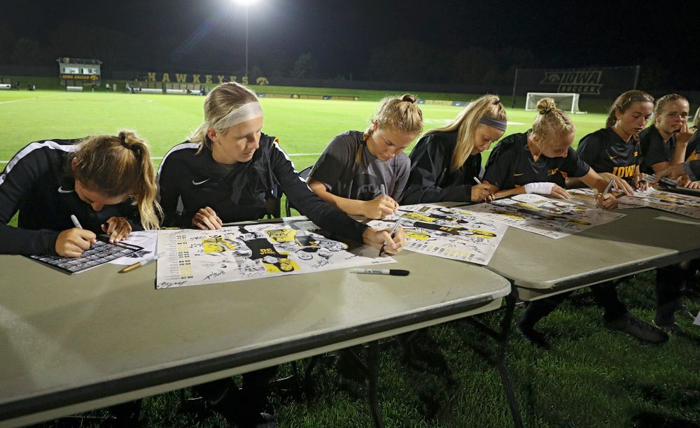 Iowa Hawkeyes players sign autographs after their match against Western Michigan at the Iowa Soccer Complex in Iowa City on Thursday, Aug 22, 2019. (Stephen Mally/hawkeyesports.com)