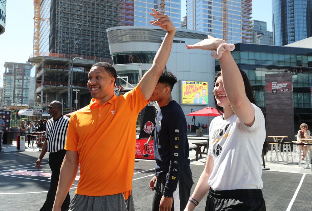 Iowa Hawkeyes forward Megan Gustafson (10) and TennesseeÕs Grant Williams during a Special Olympics event Friday, April 12, 2019 as part of the ESPN College Basketball Awards in the XBOX Plaza at LA Live.  (Brian Ray/hawkeyesports.com)