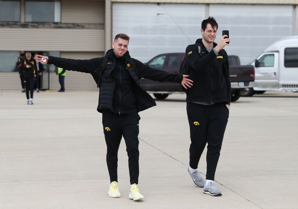 Iowa Hawkeyes guard Jordan Bohannon (3) and forward Ryan Kriener (15) board a flight to Columbus for the first and second rounds of the 2019 NCAA Men's Basketball Tournament Wednesday, March 20, 2019 at the Eastern Iowa Airport. (Brian Ray/hawkeyesports.com)