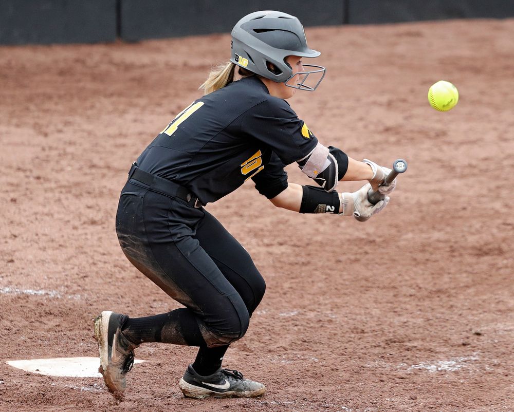 Iowa outfielder Havyn Monteer (21) lays down a bunt single during the fifth inning of their game against Iowa Softball vs Indian Hills Community College at Pearl Field in Iowa City on Sunday, Oct 6, 2019. (Stephen Mally/hawkeyesports.com)