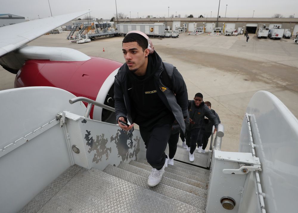Iowa Hawkeyes defensive back Amani Hooker (27) boards the team plane Wednesday, December 26, 2018 as they travel to Tampa, Florida for the Outback Bowl. (Brian Ray/hawkeyesports.com)