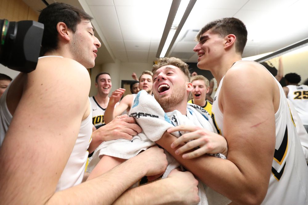 Iowa Hawkeyes guard Jordan Bohannon (3) celebrates with his teammates following their win over the Northwestern Wildcats Sunday, February 10, 2019 at Carver-Hawkeye Arena. (Brian Ray/hawkeyesports.com)