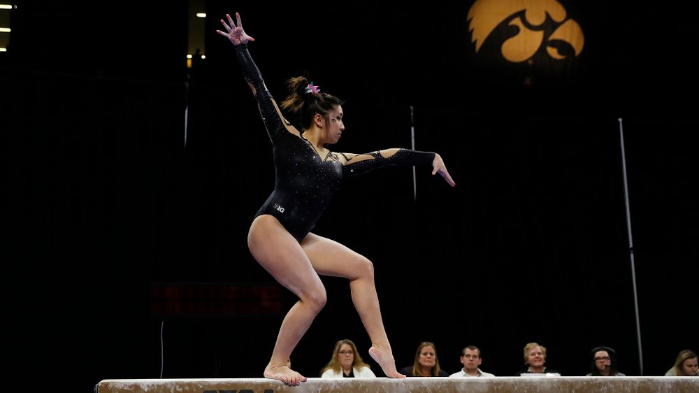 Nicole Chow competes on the beam 