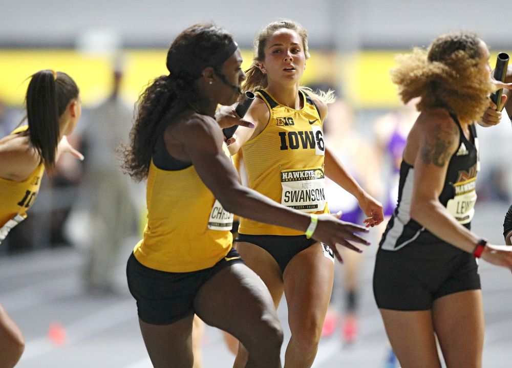 Iowa’s Addie Swanson (right) hands the baton off to Antonise Christian as they run the women’s 1600 meter relay event during the Hawkeye Invitational at the Recreation Building in Iowa City on Saturday, January 11, 2020. (Stephen Mally/hawkeyesports.com)