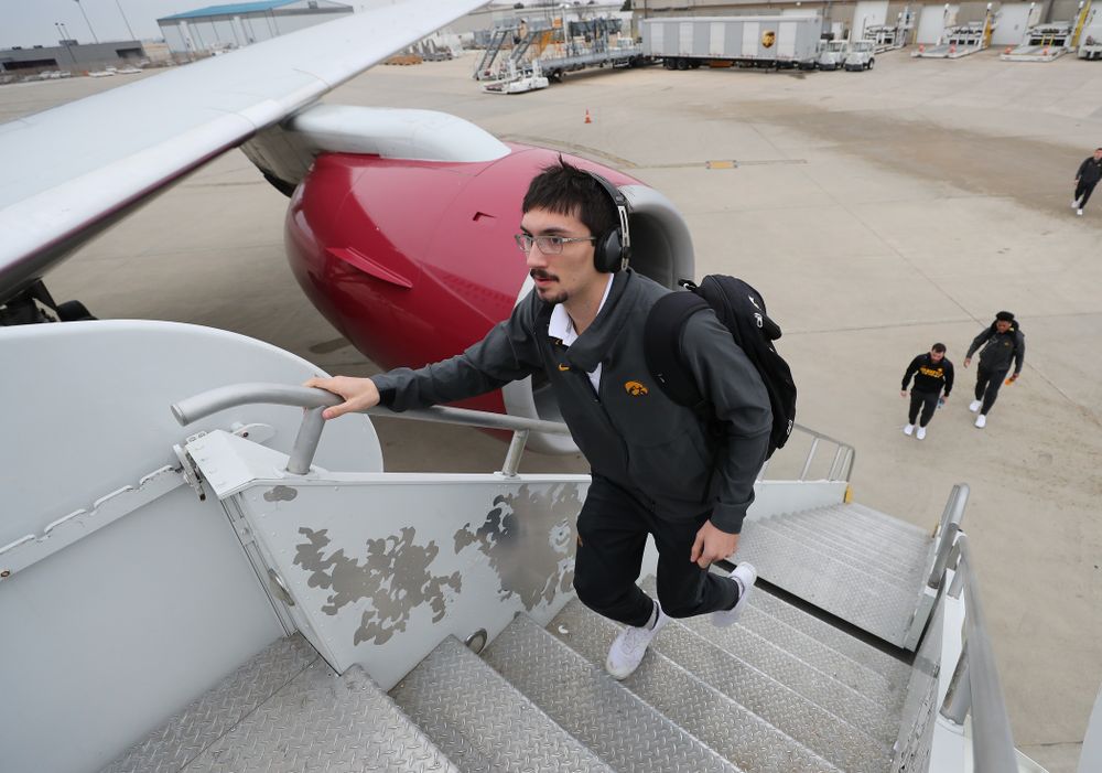 Iowa Hawkeyes place kicker Miguel Recinos (91) boards the team plane Wednesday, December 26, 2018 as they travel to Tampa, Florida for the Outback Bowl. (Brian Ray/hawkeyesports.com)