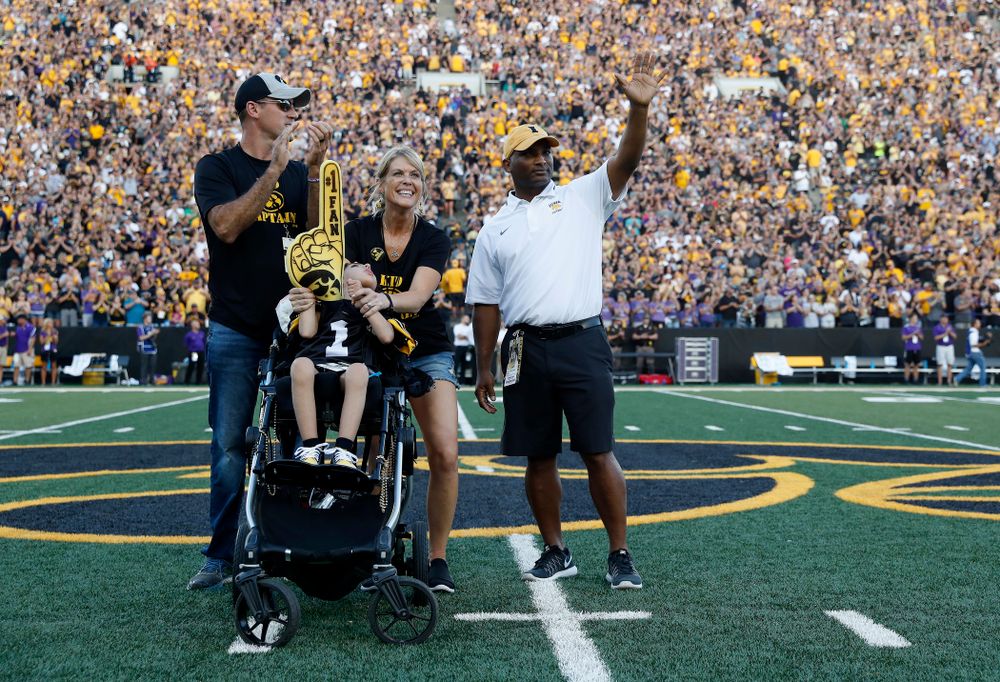 Kid Captain Quinn Stumpf and honorary captain Marvin Sims, Jr. against the Northern Iowa Panthers Saturday, September 15, 2018 at Kinnick Stadium. (Brian Ray/hawkeyesports.com)