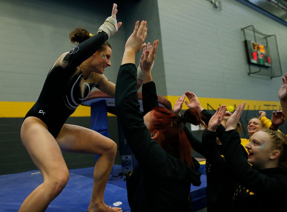 Lanie Snyder celebrates after competing on the vault during the Black and Gold Intrasquad meet at the Field House on 12/2/17. (Tork Mason/hawkeyesports.com)