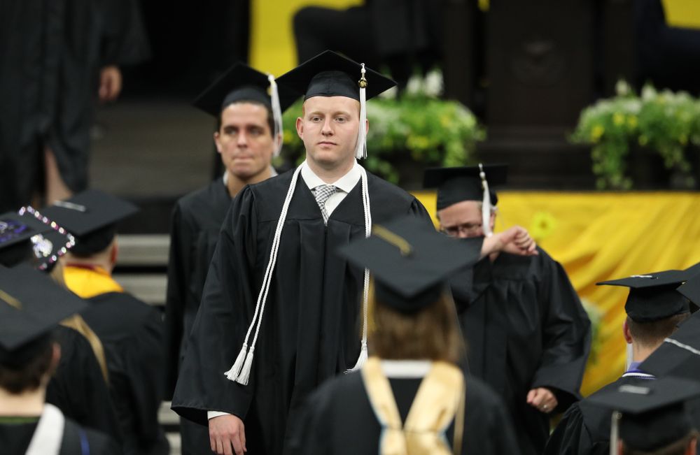 Iowa MenÕs Basketball Manager Trevor Smith during the College of Liberal Arts and Sciences spring commencement Saturday, May 11, 2019 at Carver-Hawkeye Arena. (Brian Ray/hawkeyesports.com)
