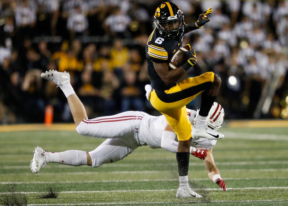 Iowa Hawkeyes wide receiver Ihmir Smith-Marsette (6) spins away from a tackle during a game against Wisconsin at Kinnick Stadium on September 22, 2018. (Tork Mason/hawkeyesports.com)