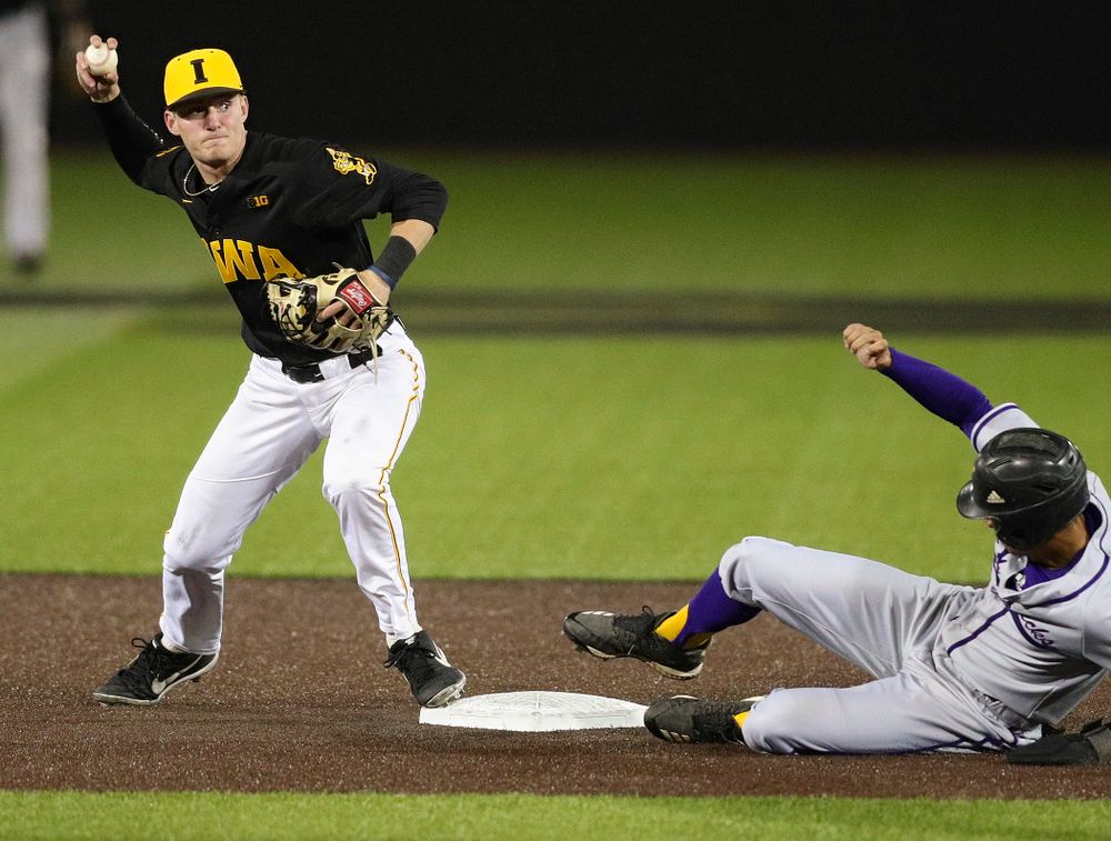 Iowa Hawkeyes second baseman Brendan Sher (2) throws to first base as they turn a double play during the seventh inning of their game against Western Illinois at Duane Banks Field in Iowa City on Wednesday, May. 1, 2019. (Stephen Mally/hawkeyesports.com)