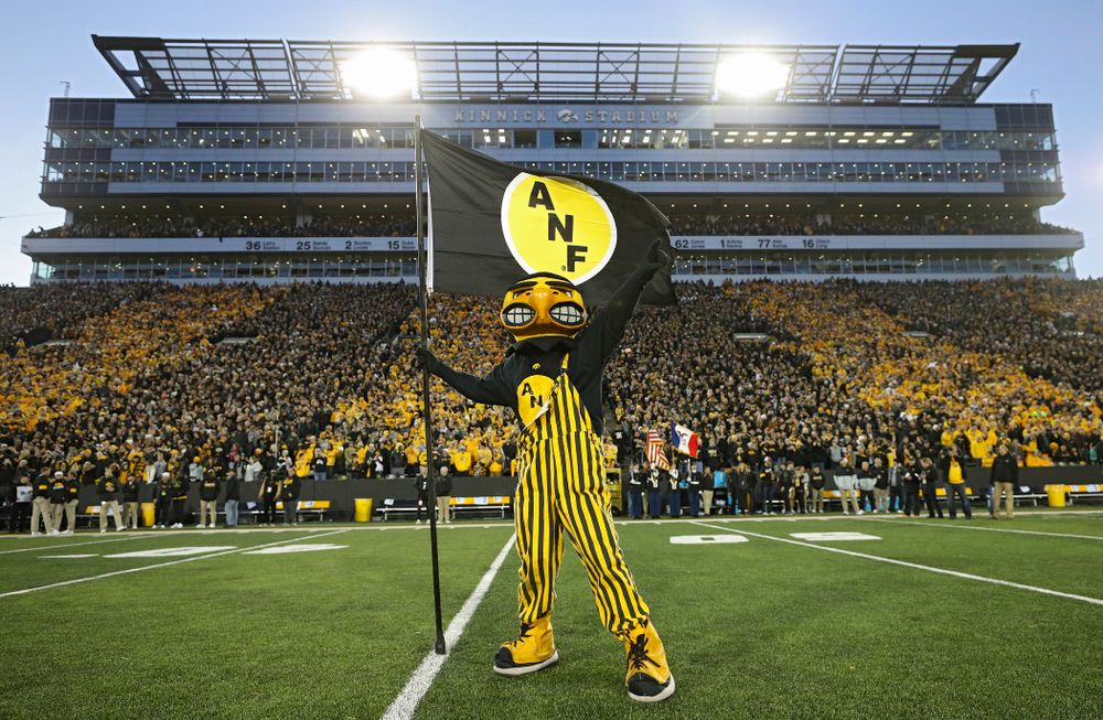 Herky plants an ANF flag after taking the field before their game at Kinnick Stadium in Iowa City on Saturday, Oct 12, 2019. (Stephen Mally/hawkeyesports.com)