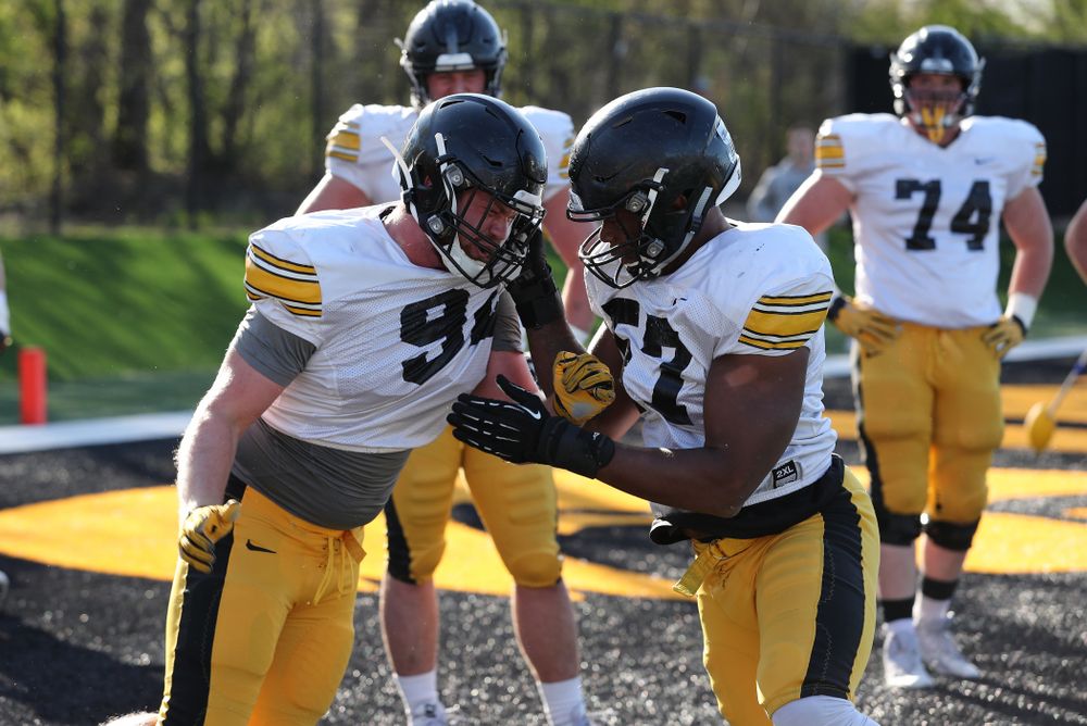 Iowa Hawkeyes defensive lineman John Waggoner (92) and defensive end Chauncey Golston (57) during the teamÕs final spring practice Friday, April 26, 2019 at the Kenyon Football Practice Facility. (Brian Ray/hawkeyesports.com)