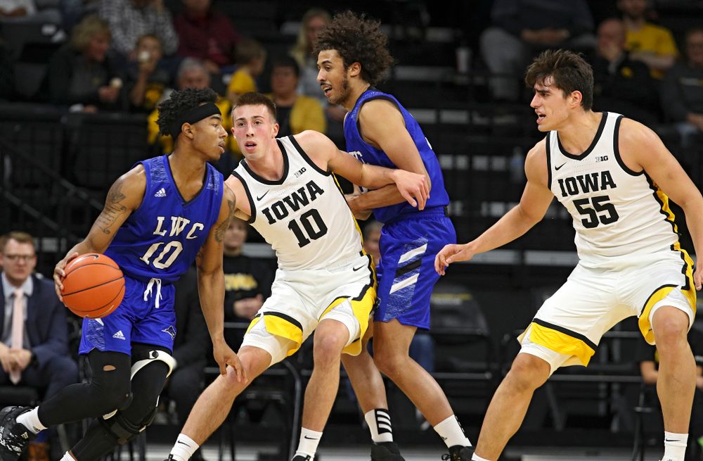 Iowa Hawkeyes guard Joe Wieskamp (10) defends with center Luka Garza (55) during the first half of their exhibition game against Lindsey Wilson College at Carver-Hawkeye Arena in Iowa City on Monday, Nov 4, 2019. (Stephen Mally/hawkeyesports.com)