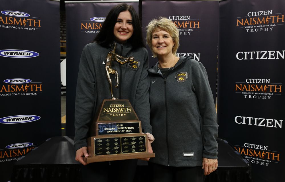 Iowa Hawkeyes forward Megan Gustafson (10) and head coach Lisa Bluder with the Naismith Player Of The Year Trophy during the teamÕs Celebr-Eight event Wednesday, April 24, 2019 at Carver-Hawkeye Arena. (Brian Ray/hawkeyesports.com)