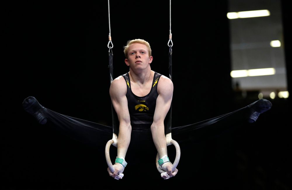 Nick Merryman competes on the rings against Illinois 