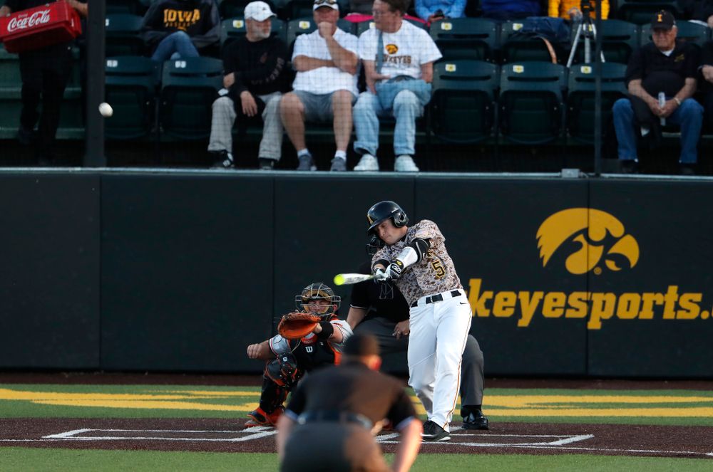 Iowa Hawkeyes catcher Tyler Cropley (5) hits a home run against Oklahoma State Friday, May 4, 2018 at Duane Banks Field. (Brian Ray/hawkeyesports.com)