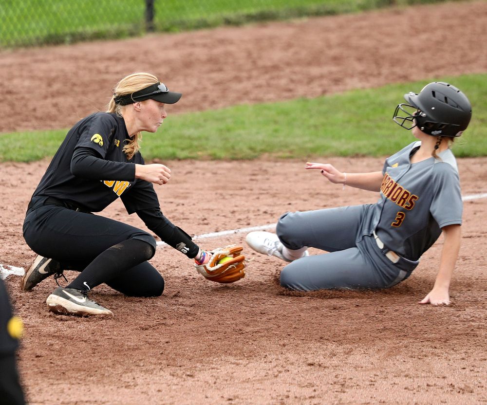 Iowa third basemans Ashley Hamilton (18) tags out a runner trying to steal during the fifth inning of their game against Iowa Softball vs Indian Hills Community College at Pearl Field in Iowa City on Sunday, Oct 6, 2019. (Stephen Mally/hawkeyesports.com)