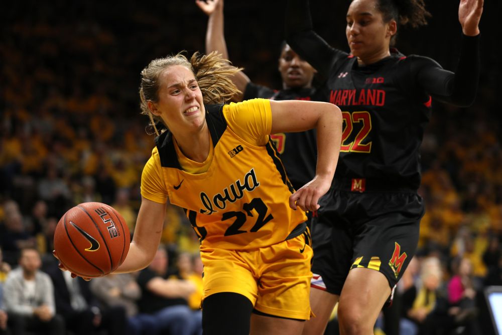 Iowa Hawkeyes guard Kathleen Doyle (22) dishes off a pass Against the Maryland Terrapins Thursday, January 9, 2020 at Carver-Hawkeye Arena. (Brian Ray/hawkeyesports.com)