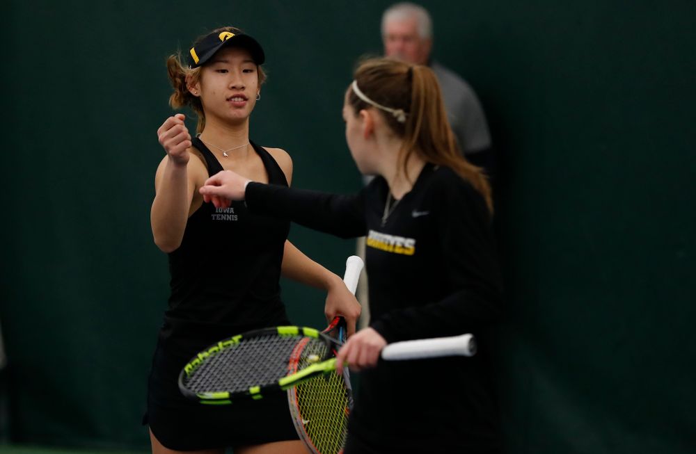 Iowa's Yufei Long and Zoe Douglas play a doubles match against Marquette 