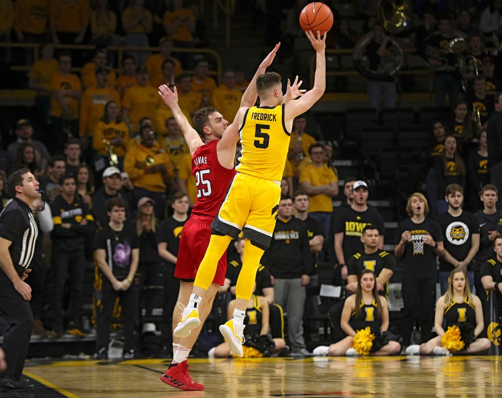 Iowa Hawkeyes guard CJ Fredrick (5) makes a 3-pointer at the end of the first half of their game at Carver-Hawkeye Arena in Iowa City on Saturday, February 8, 2020. (Stephen Mally/hawkeyesports.com)