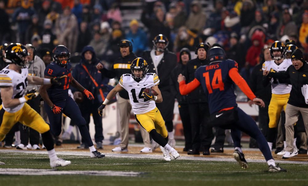 Iowa Hawkeyes wide receiver Kyle Groeneweg (14) returns a punt for a touchdown against the Illinois Fighting Illini Saturday, November 17, 2018 at Memorial Stadium in Champaign, Ill. (Brian Ray/hawkeyesports.com)