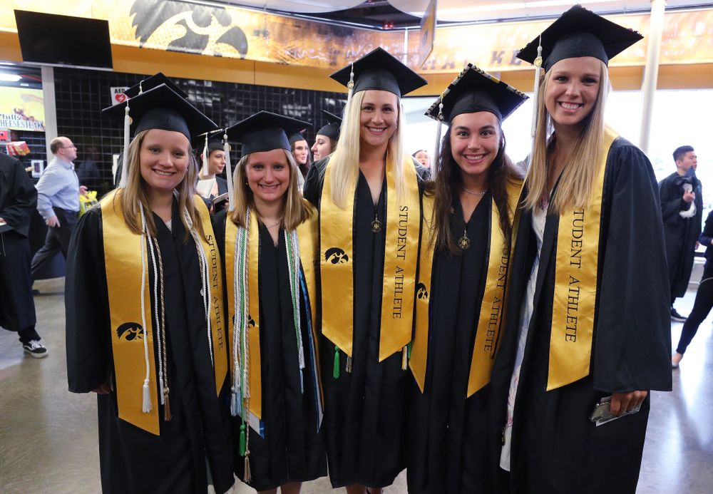 Members of the Iowa Rowing Team during the College of Liberal Arts and Sciences spring commencement Saturday, May 11, 2019 at Carver-Hawkeye Arena. (Brian Ray/hawkeyesports.com)