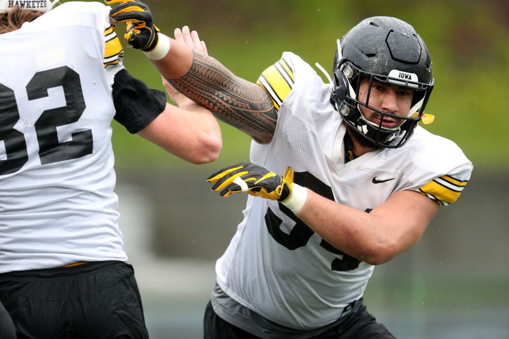 Iowa Hawkeyes defensive end A.J. Epenesa (94) works a drill during practice Monday, December 23, 2019 at Mesa College in San Diego. (Brian Ray/hawkeyesports.com)