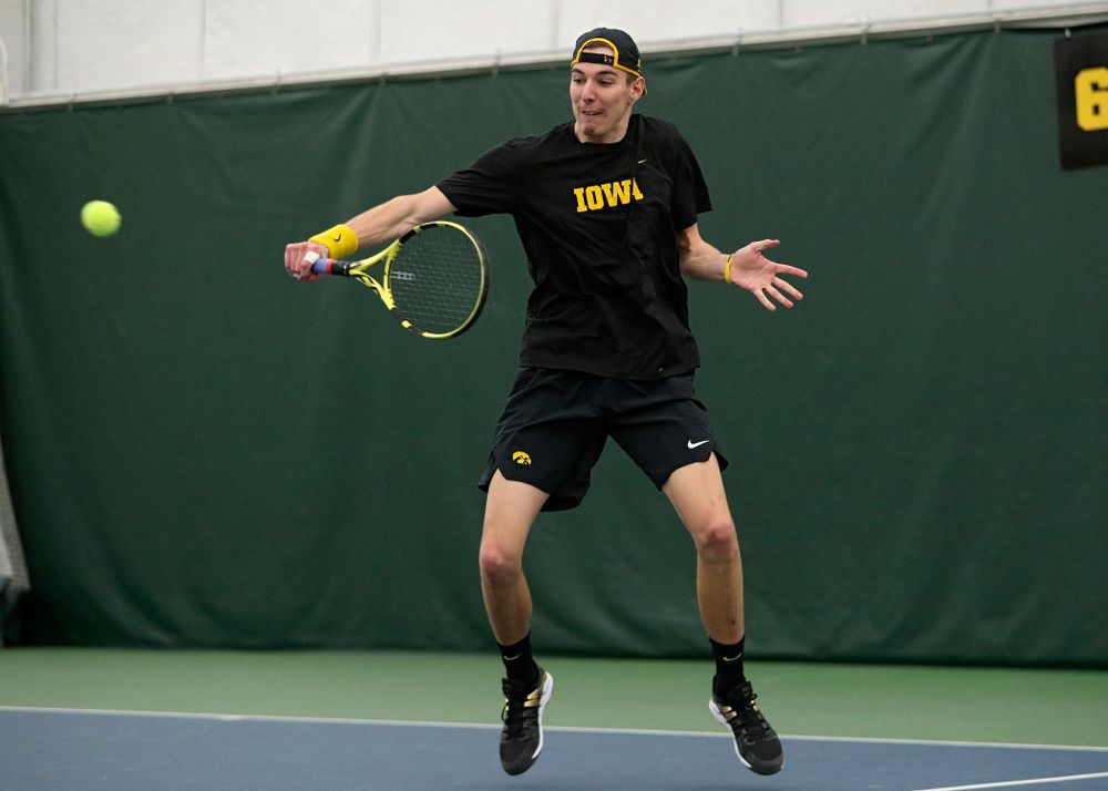 Iowa’s Nikita Snezhko returns a shot during his singles match at the Hawkeye Tennis and Recreation Complex in Iowa City on Friday, March 6, 2020. (Stephen Mally/hawkeyesports.com)