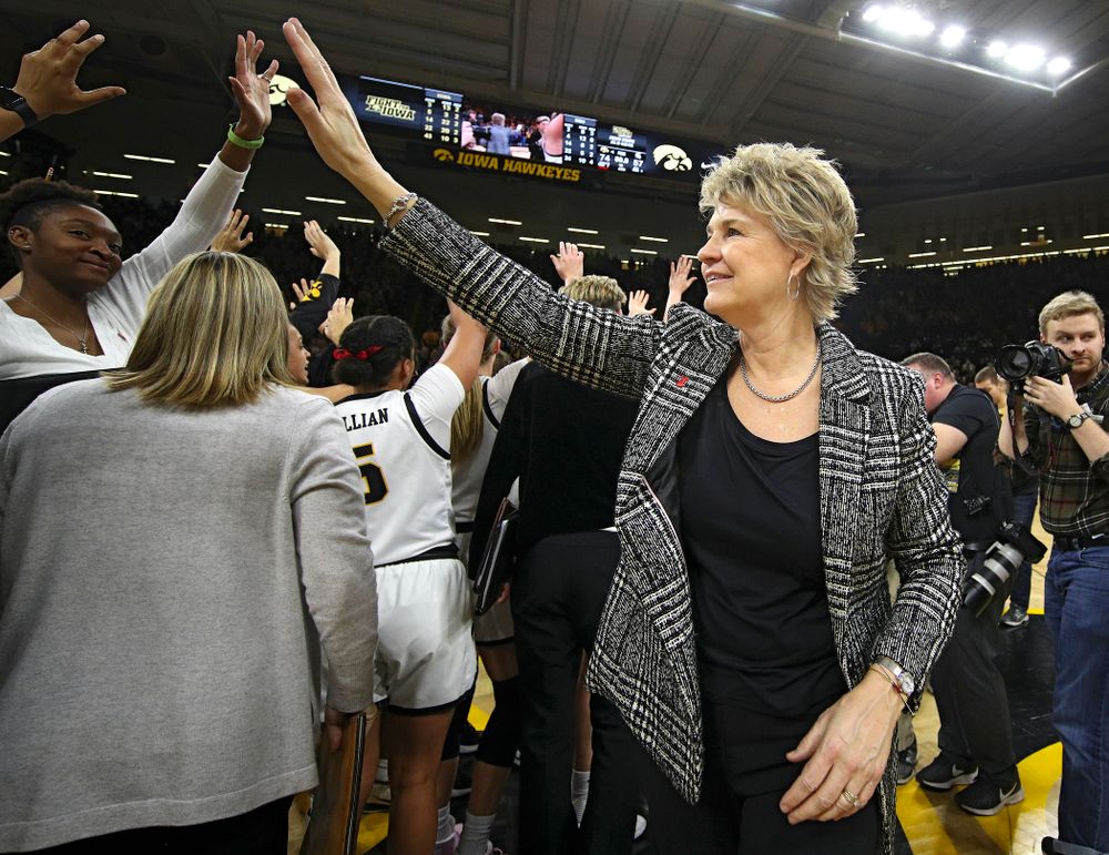 Iowa Hawkeyes head coach Lisa Bluder waves to the fans after winning their game at Carver-Hawkeye Arena in Iowa City on Sunday, January 26, 2020. (Stephen Mally/hawkeyesports.com)