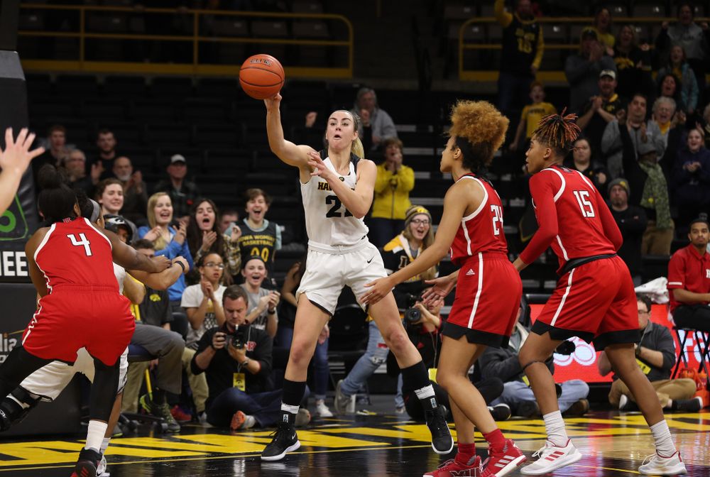 Iowa Hawkeyes forward Hannah Stewart (21) kicks the ball out after getting a block and a steal against the Rutgers Scarlet Knights Wednesday, January 23, 2019 at Carver-Hawkeye Arena. (Brian Ray/hawkeyesports.com)
