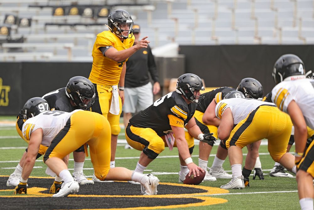 Iowa Hawkeyes quarterback Nate Stanley (4) points across the line before a snap during Fall Camp Practice No. 8 at Kids Day at Kinnick Stadium in Iowa City on Saturday, Aug 10, 2019. (Stephen Mally/hawkeyesports.com)