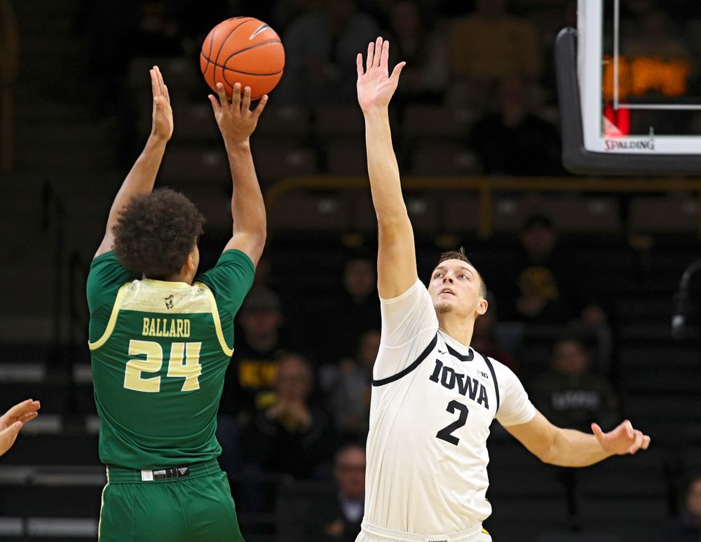 Iowa Hawkeyes forward Jack Nunge (2) tries to block a shot during the first half of their game at Carver-Hawkeye Arena in Iowa City on Sunday, Nov 24, 2019. (Stephen Mally/hawkeyesports.com)