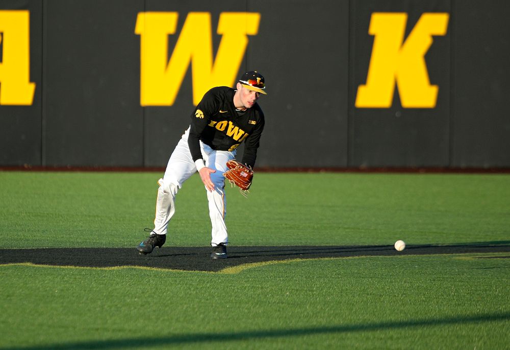 Iowa outfielder Ben Norman (9) fields a ball during the fifth inning of their game at Duane Banks Field in Iowa City on Tuesday, March 3, 2020. (Stephen Mally/hawkeyesports.com)