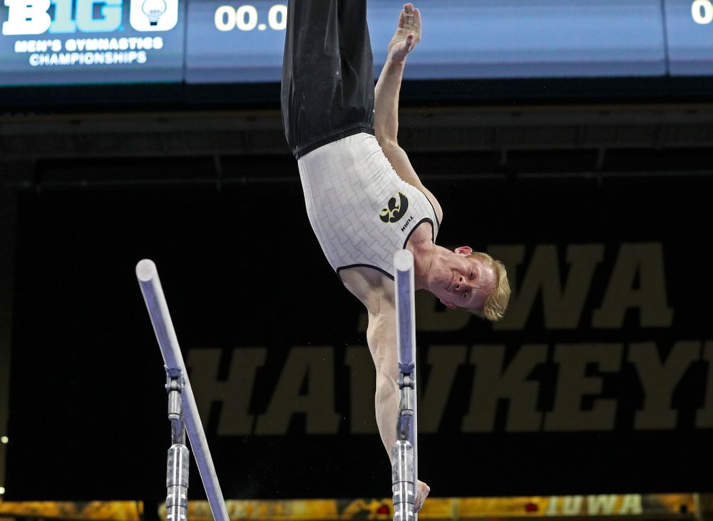 Iowa's Nick Merryman competes in the parallel bars during the second day of the Big Ten Men's Gymnastics Championships at Carver-Hawkeye Arena in Iowa City on Saturday, Apr. 6, 2019. (Stephen Mally/hawkeyesports.com)
