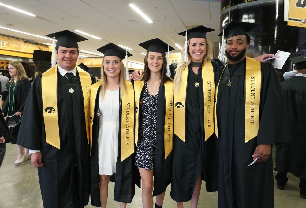 Iowa BaseballÕs Luke Farley, Field HockeyÕs Makenna Grewe and Isabella Brown, WomenÕs BasketballÕs Hannah Stewart and FotoballÕs Dominique Dafney during the College of Liberal Arts and Sciences spring commencement Saturday, May 11, 2019 at Carver-Hawkeye Arena. (Brian Ray/hawkeyesports.com)