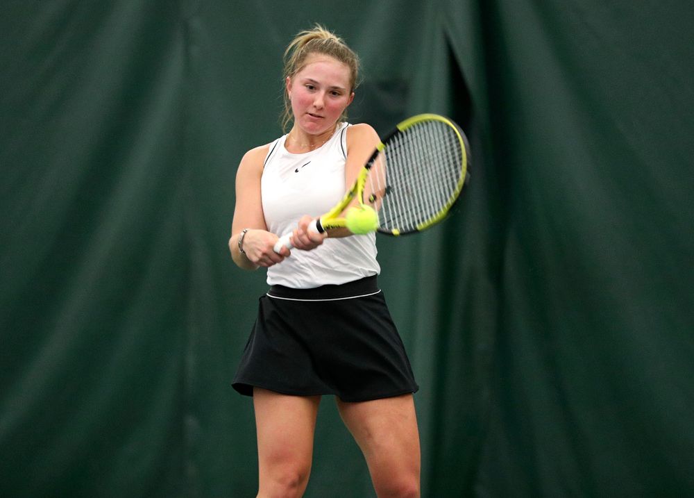 Iowa’s Danielle Burich returns a shot during her singles match at the Hawkeye Tennis and Recreation Complex in Iowa City on Sunday, February 16, 2020. (Stephen Mally/hawkeyesports.com)